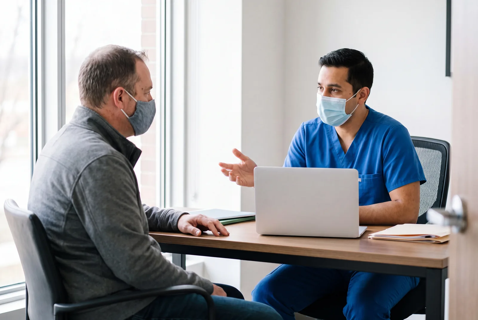 Consultation desk masked at Urgent Care USA, Plant City FL
